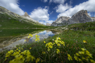 Scenic view of lake and mountains against sky