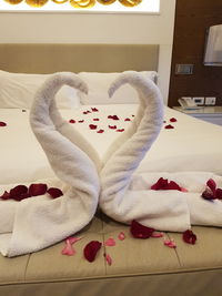 Close-up of woman relaxing on bed at home