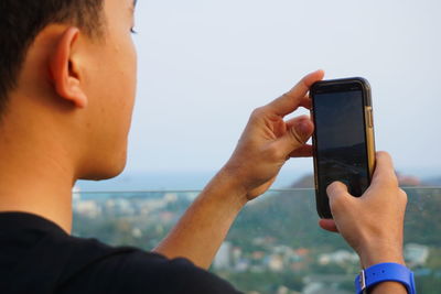 Man photographing from mobile phone