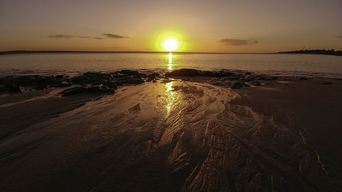 Scenic view of beach during sunset