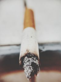 Close-up of cigarette against black background