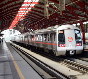 Delhi metro train arriving at jhandewalan metro station in new delhi, india, asia, public metro