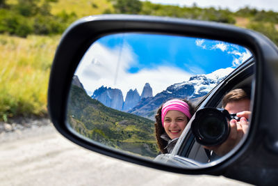 Close-up of a side-view mirror of car
