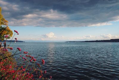 View of calm sea against cloudy sky