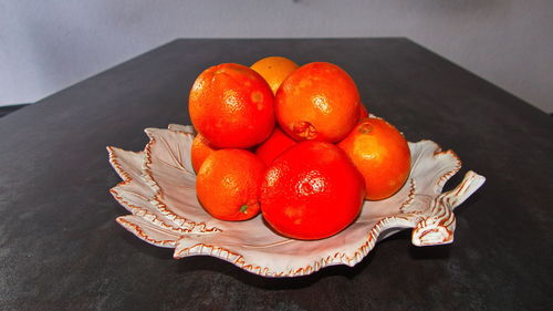 High angle view of tomatoes in plate on table