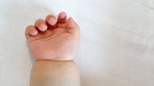 Low section of person feet on tiled floor