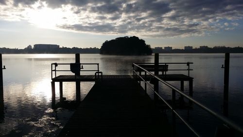 Empty jetty leading to lake