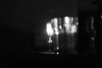 Close-up of illuminated light bulb in darkroom