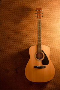 Close-up of guitar on table at home