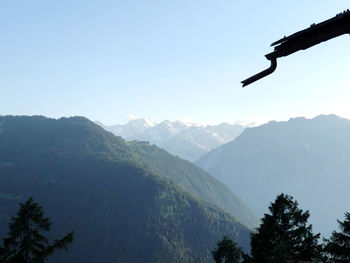 Scenic view of silhouette mountains against clear sky