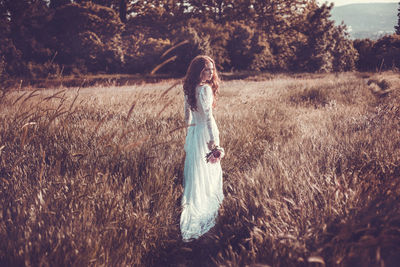 Woman standing on field