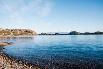 Scenic view of sea against blue sky