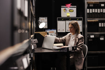 Woman using laptop at home