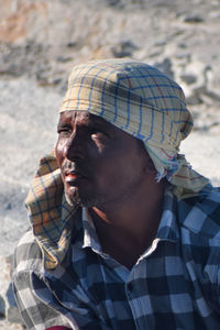 Portrait of young man looking away