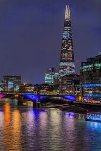 Illuminated city at waterfront