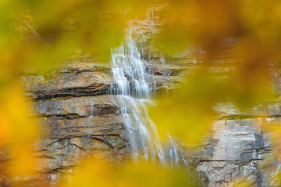 Close-up of waterfall against blurred background