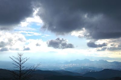 Scenic view of mountains against cloudy sky