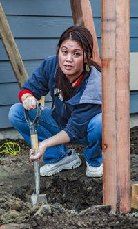 Portrait of girl working on wood