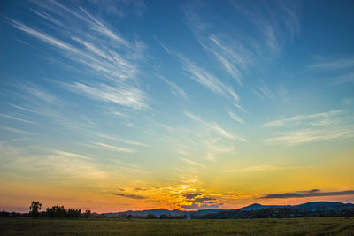 Scenic view of landscape against sky during sunset