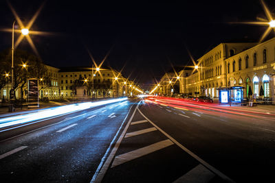 Light trails on road in city at night