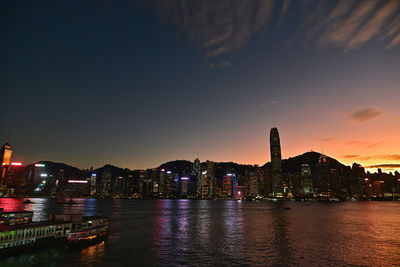 Illuminated city at waterfront