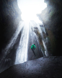 Rear view of man walking on mountain