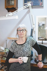 Portrait of woman sitting on chair