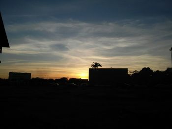 House against sky during sunset