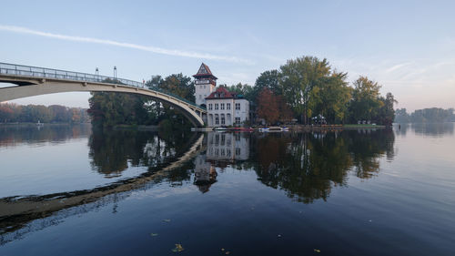 Bridge over river with buildings in background