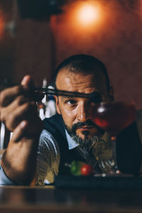 Portrait of man holding camera