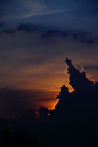 Low angle view of silhouette rocks against sky during sunset