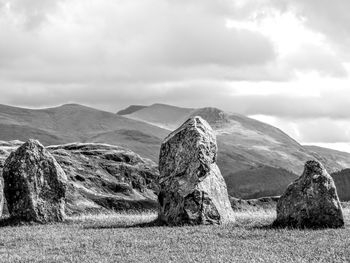 Panoramic view of rocks on land against sky