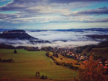 Scenic view of agricultural landscape against sky