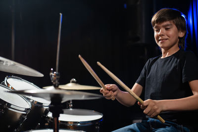 Boy playing drums