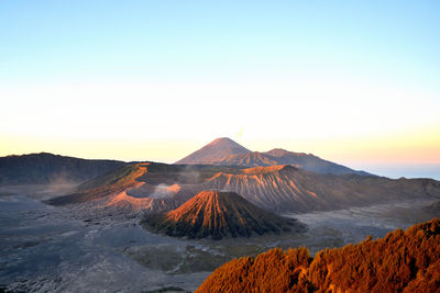 Panoramic view of volcanic landscape against sky during sunset