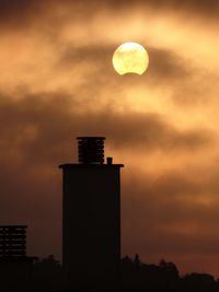 Silhouette of tree against sky at sunset