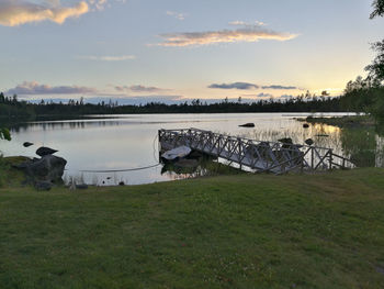 Scenic view of lake against sky during sunset