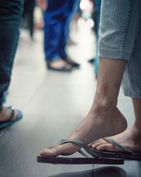 Low section of woman standing on floor