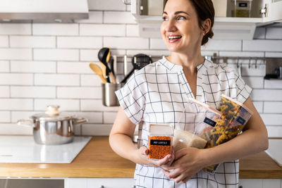 Woman holding food at home