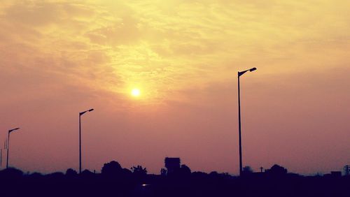 Street light against sky during sunset