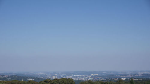 Scenic view of landscape against clear blue sky