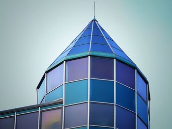 Low angle view of modern building against clear blue sky