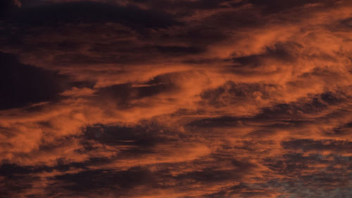 Low angle view of dramatic sky during sunset