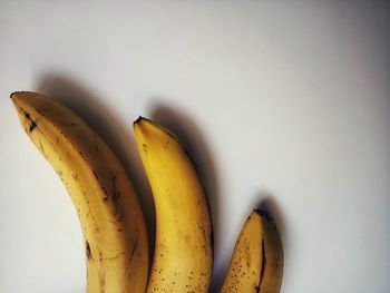 Close-up of bananas against white background