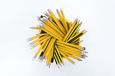 Close-up of yellow umbrella against white background