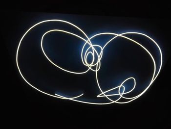 Close-up of light painting against black background