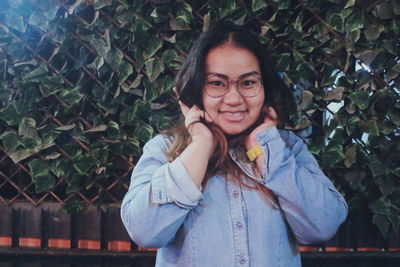 Portrait of smiling girl standing outdoors