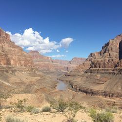 View of rock formations against blue sky