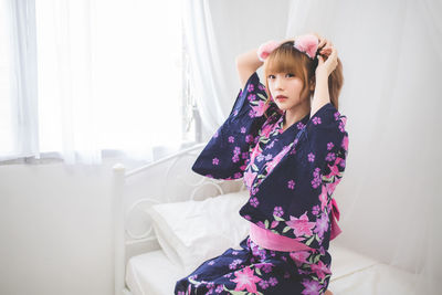 Happy girl standing at home