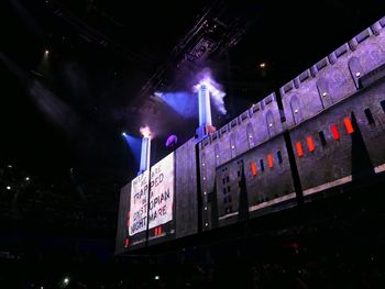 Low angle view of illuminated sign at night